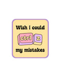 A square graphic with rounded corners featuring the text 'Wish i could ctrl my mistakes' in black on a pale yellow background, with a pink and lavender keyboard key illustration in the center.