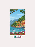 A vertical travel poster print featuring a colorful vector illustration of a coastal Italian town with boats on blue water, green hills, mountains, and the word 'ITALY' at the bottom, shown on a light beige background.