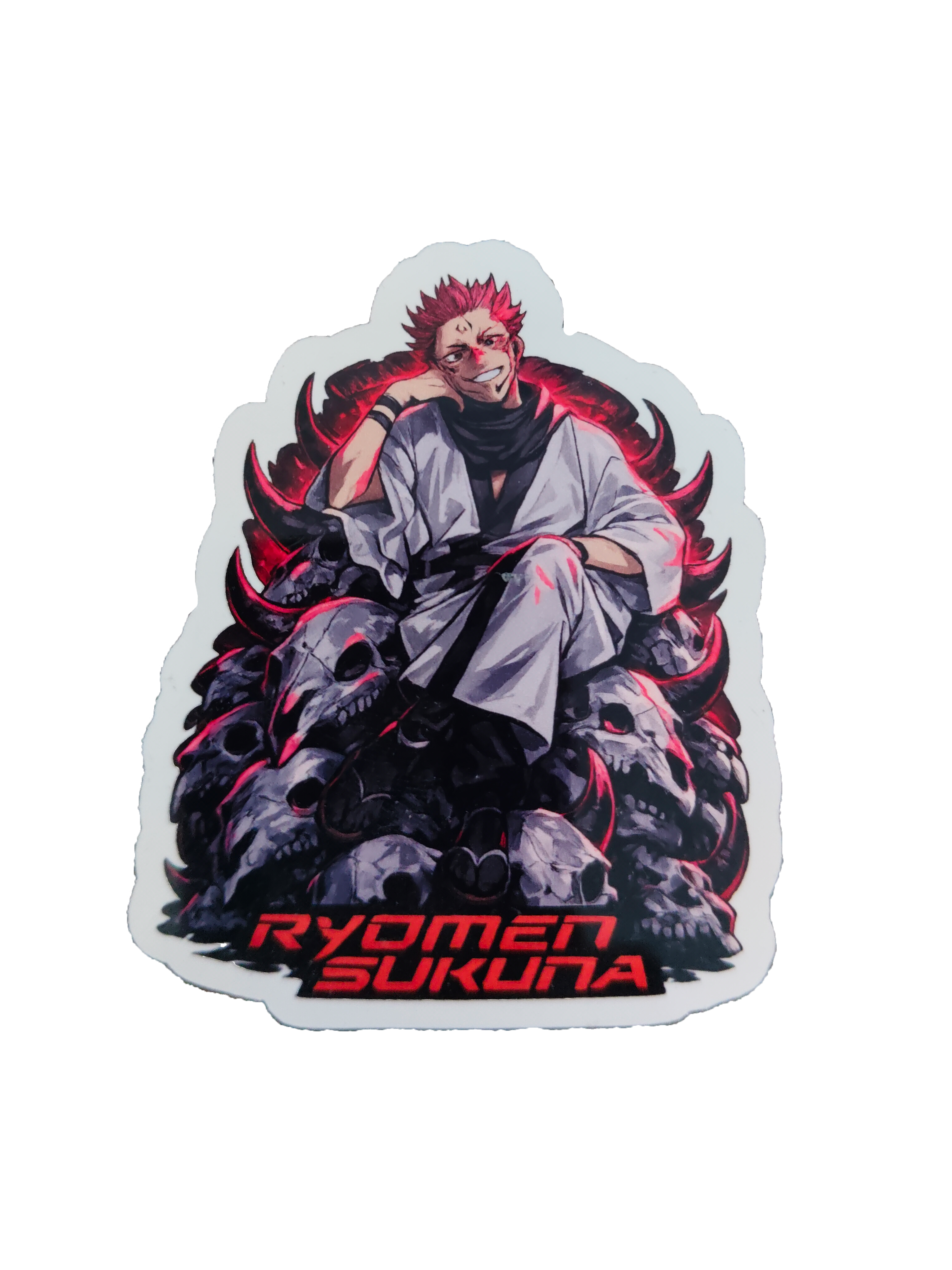 A die-cut sticker featuring an anime-style illustration of Ryomen Sukuna seated on a pile of skulls with glowing red accents, and the text 'RYOMEN SUKUNA' in red at the bottom, shown on a plain white background.